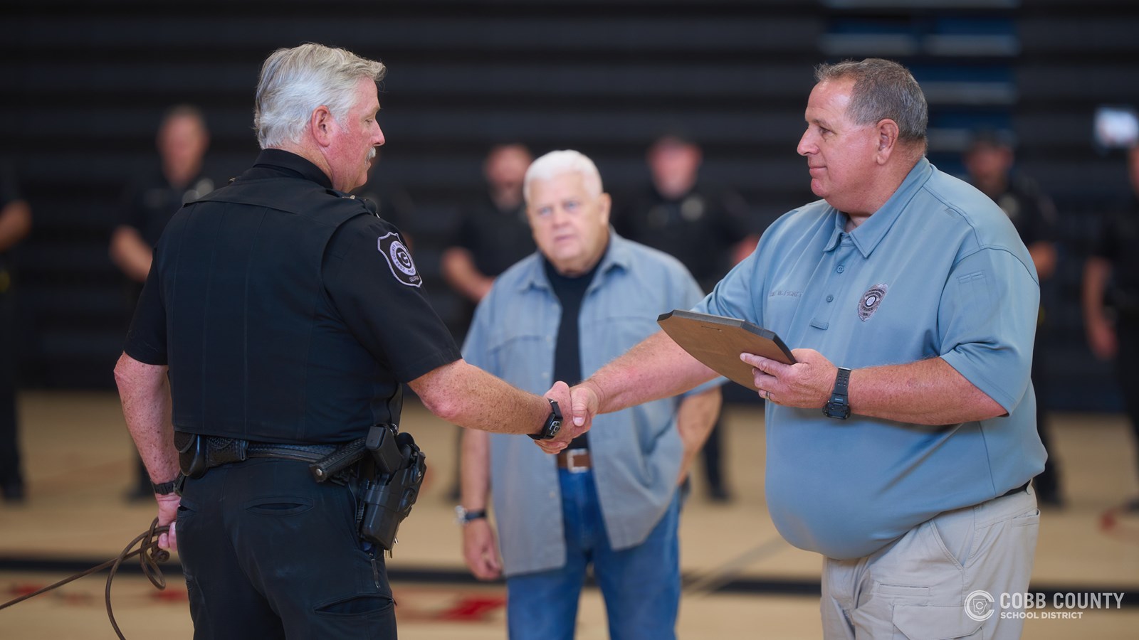 K-9 Sadie, a narcotics detection dog with the Cobb County School District Police Department, is honored during her retirement celebration after 11 years of service supporting school safety across Cobb Schools.
