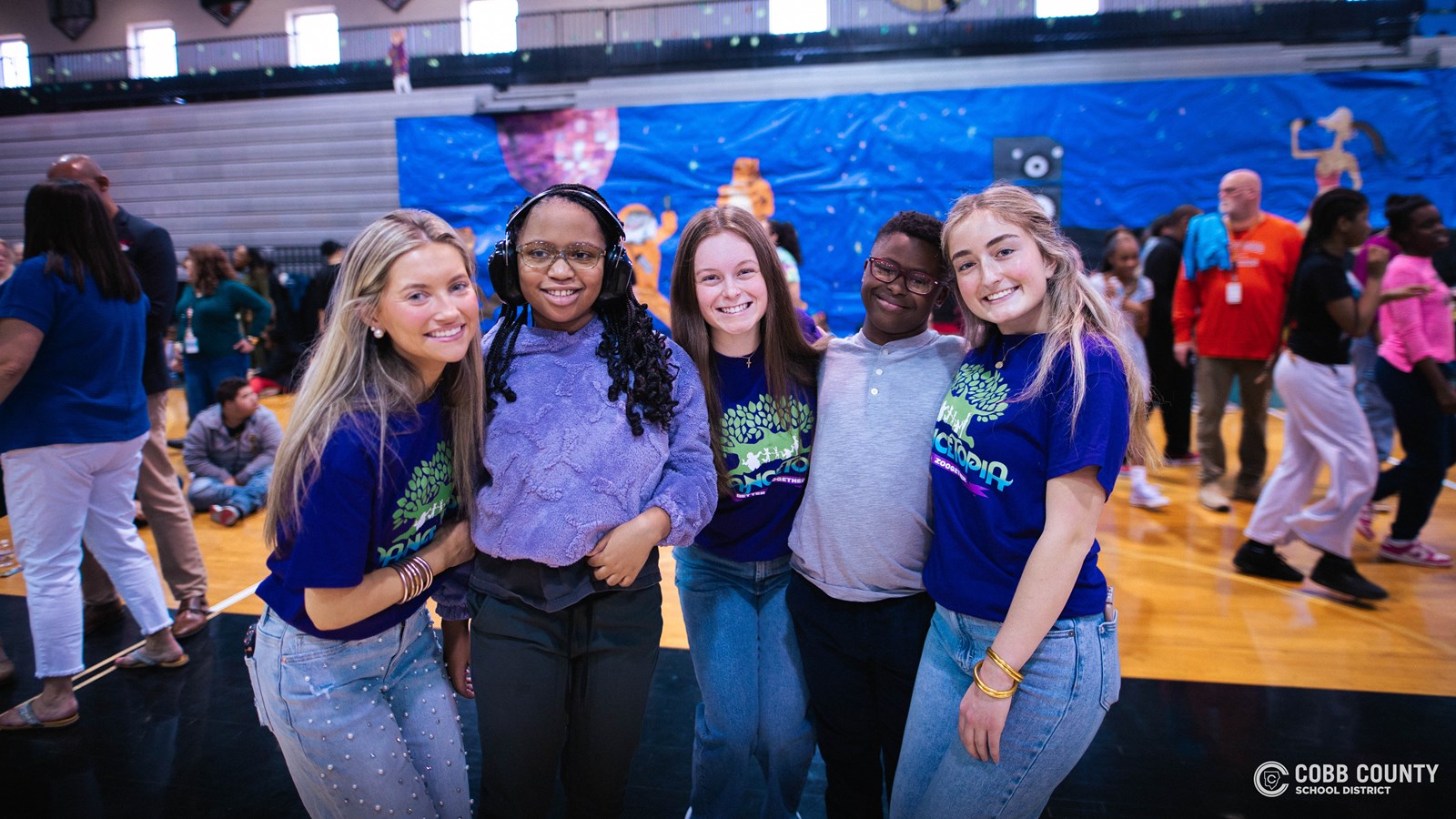 Students and volunteers dancing together at the Cobb Schools Special Education Dance.
