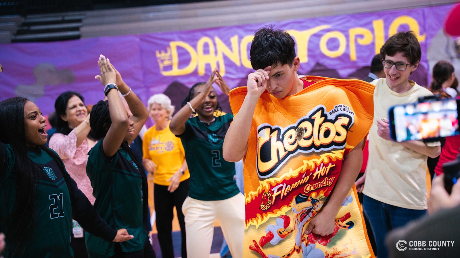 Students and volunteers dancing together at the Cobb Schools Special Education Dance.