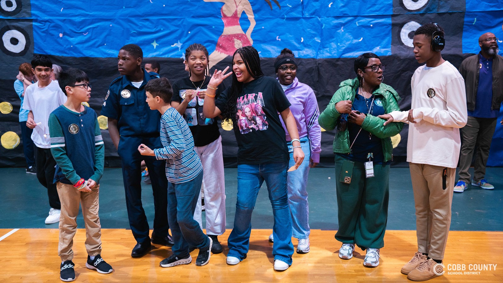 Students and volunteers dancing together at the Cobb Schools Special Education Dance.