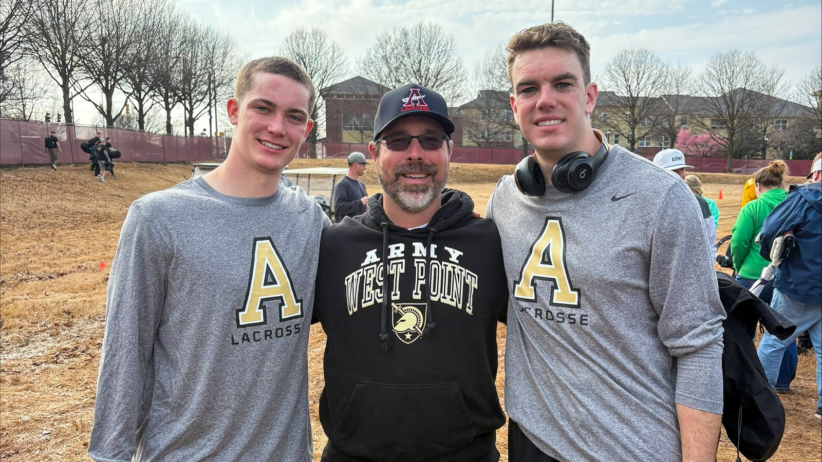 Allatoona Coach Jonathan Wishon spends time with Fountain and Byrne after an Army game
