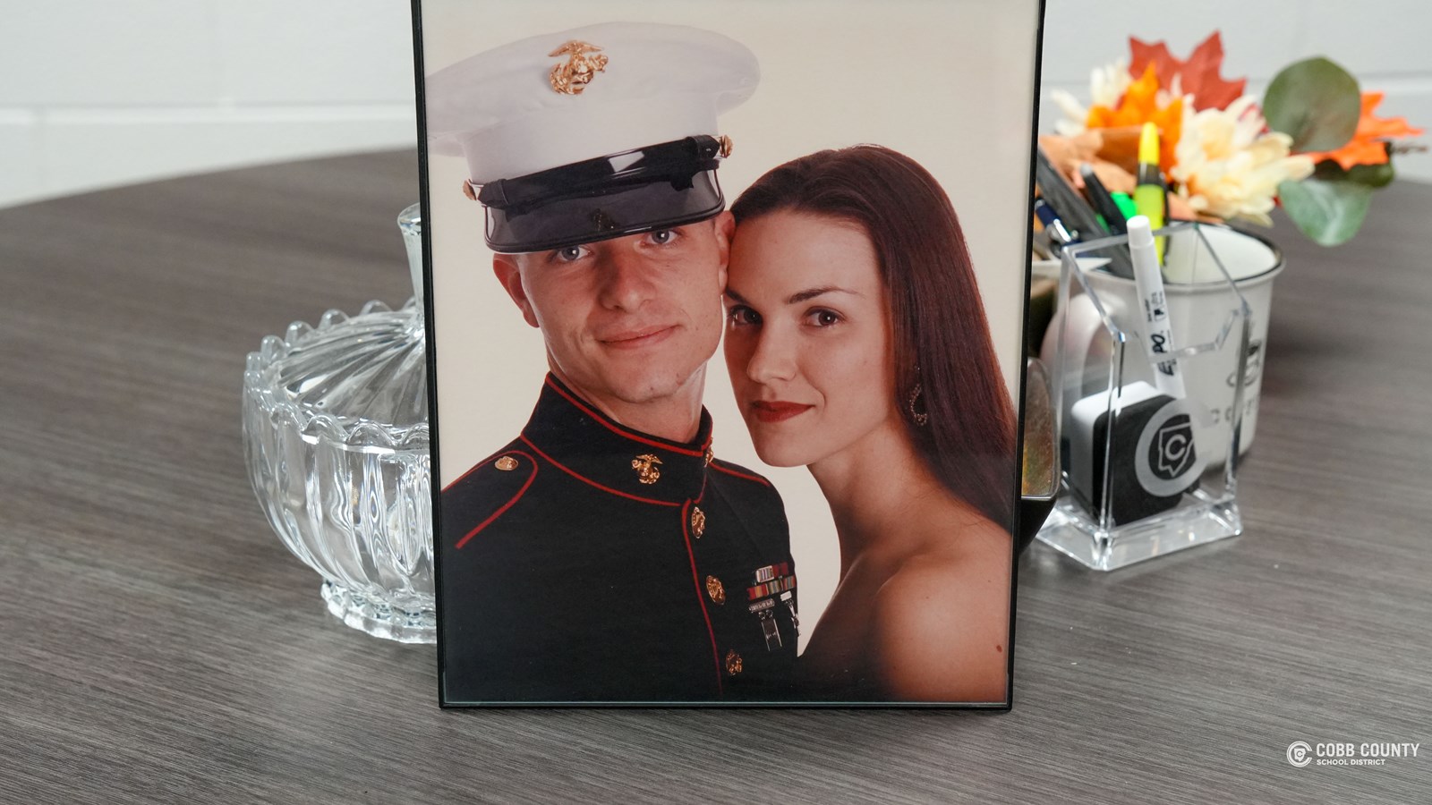 Principal Askew proudly displays a picture of him in his Marines uniform.