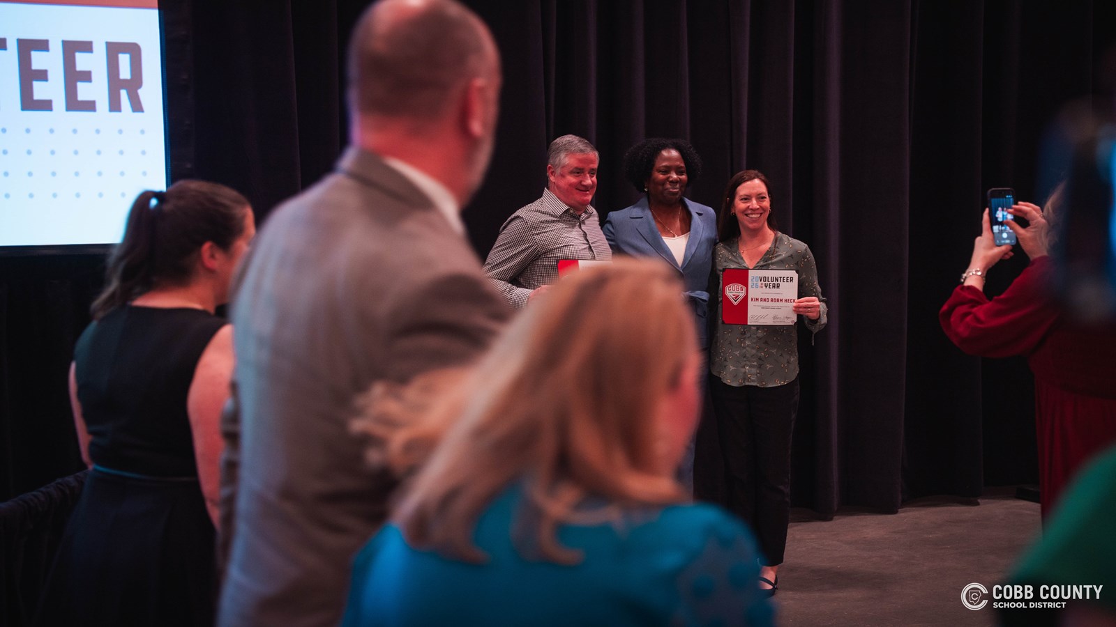 2026 Cobb Schools Volunteers of the Year recognized on stage at the annual luncheon.