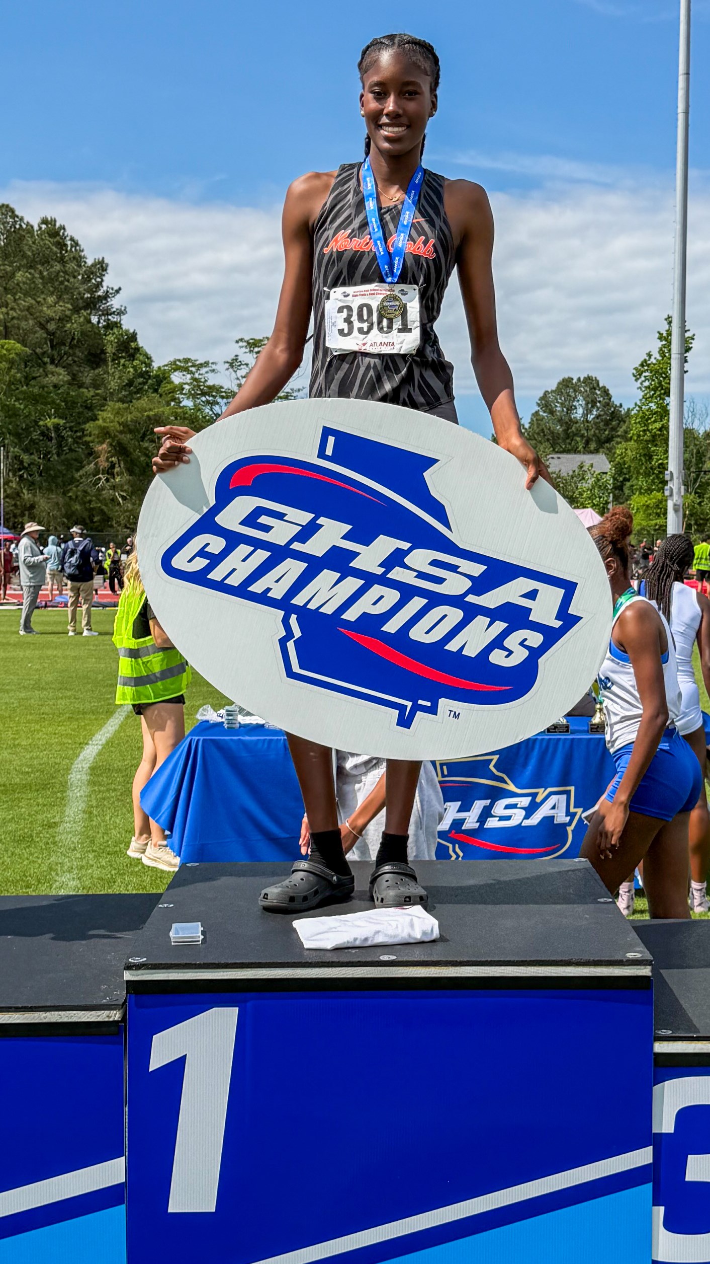 North Cobb's Zoe Oye atop the champions podium