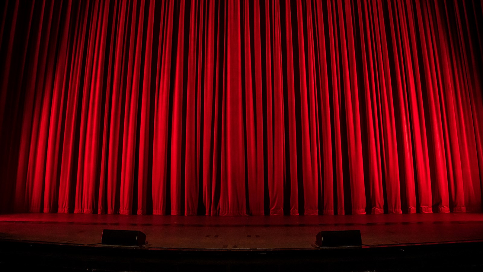 Stage with red curtain closed