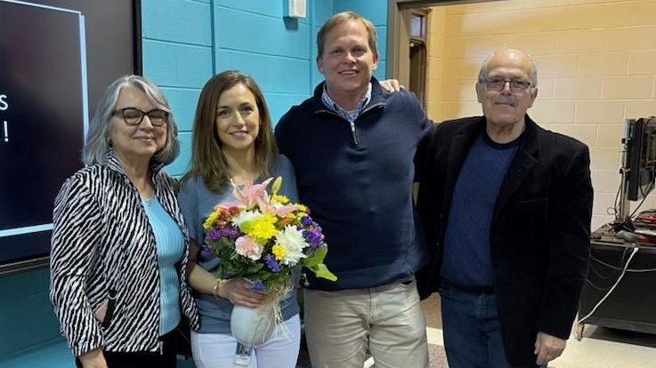 4 people standing together