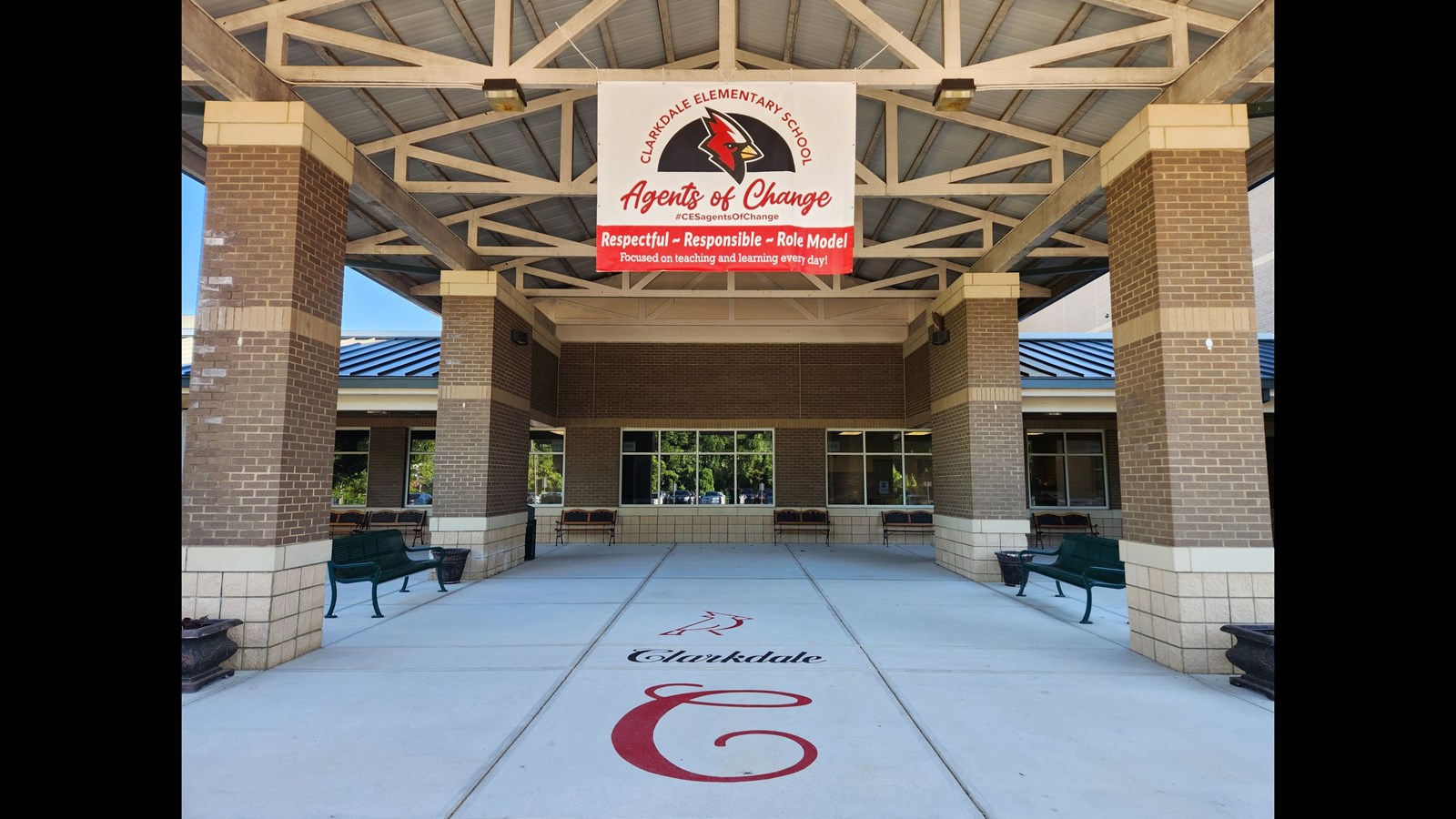 Agents of Change banner at front of school