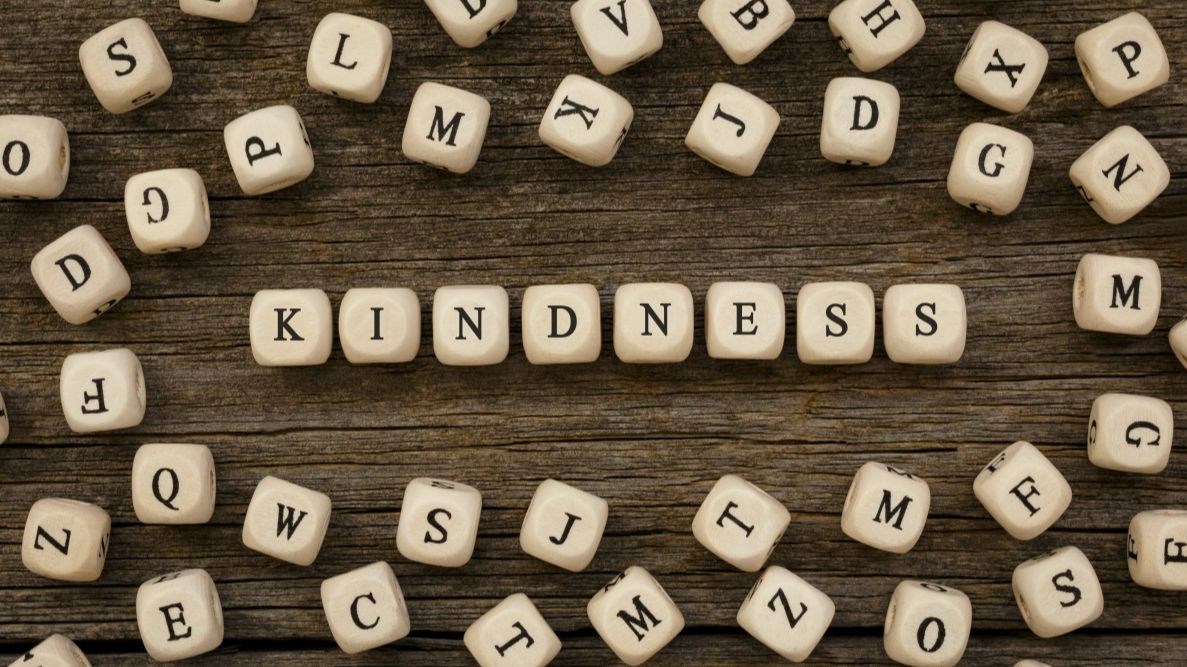 Boggle pieces spelling out Kindness
