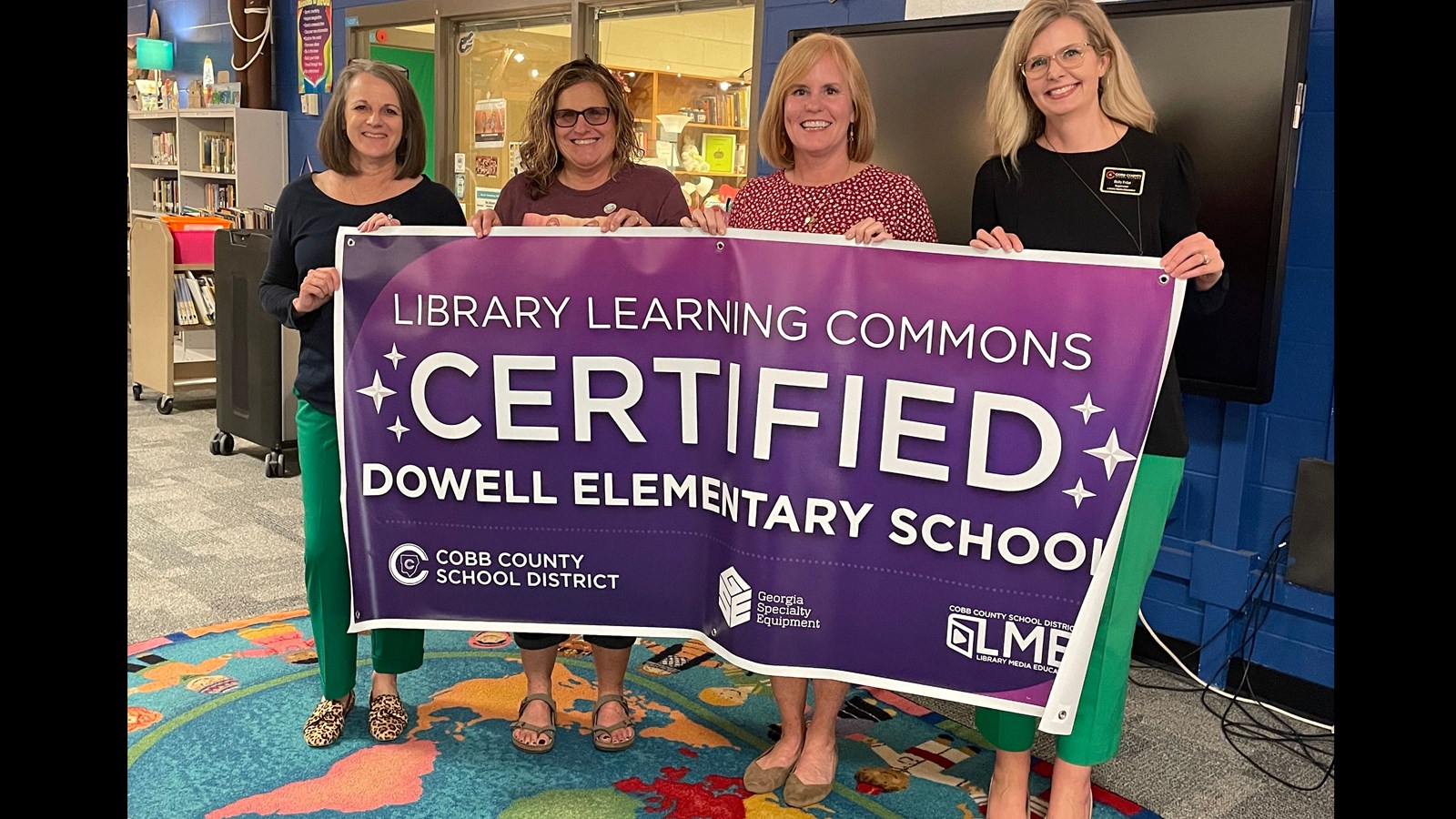 Banner and four women