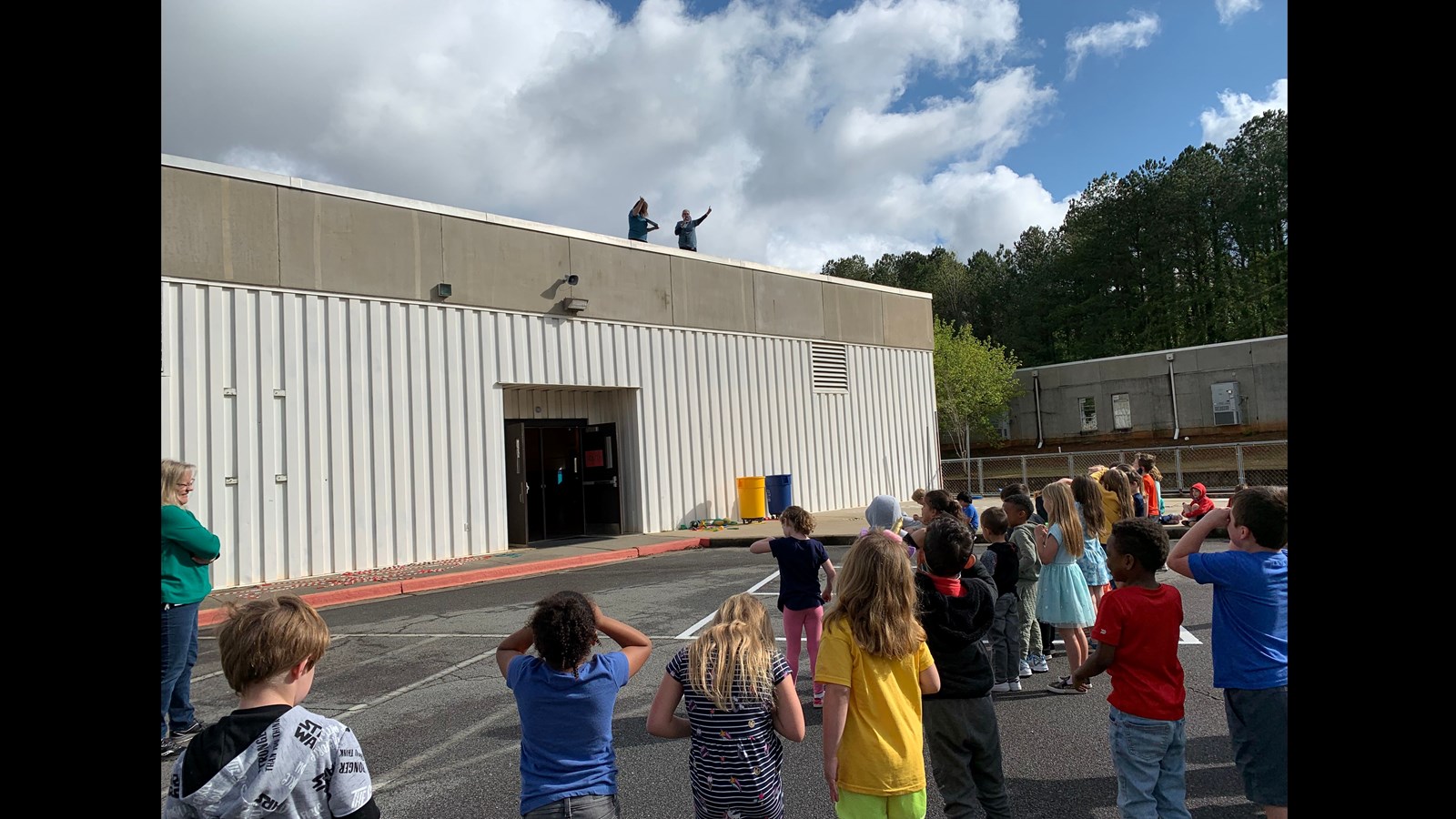 Students watching roof readers