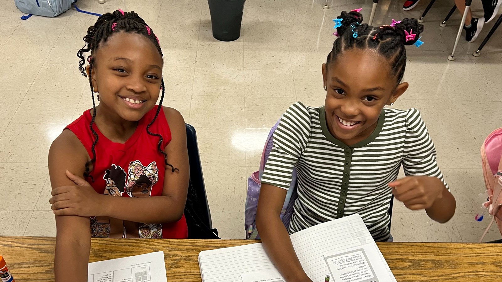 Two students working at their desk