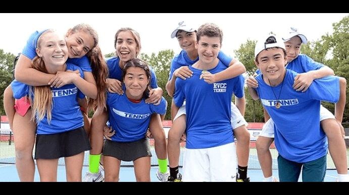 boys and girls teens playing tennis