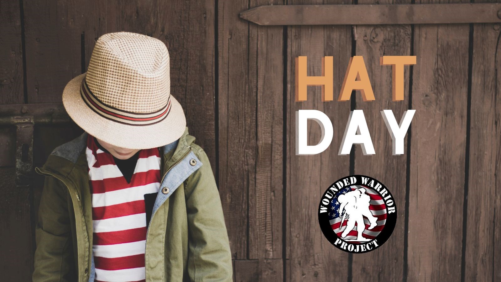 rustic board wall. student in straw fedora, red and white stripped shirt and green jacket standing against wall. Text reads Hat Day. Wounded warrior project below