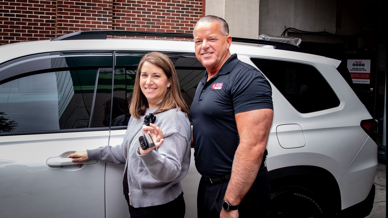 Karen Wright picks up the keys to her new car as Cobb's Teacher of the Year