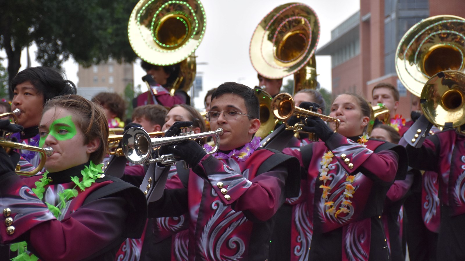 Lassiter High School band marches in 2024 Fiesta Flambeau Parade.