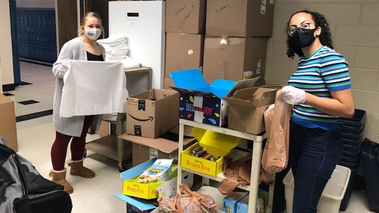 Sprayberry High School JROTC students help pack duffel bags for those in need
