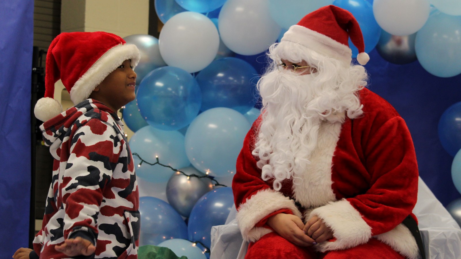 Signing Santa visits Cobb students.