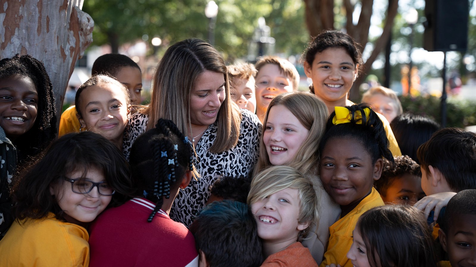 Cobb Schools Teacher of the Year is congratulated by her students on Marietta Square.