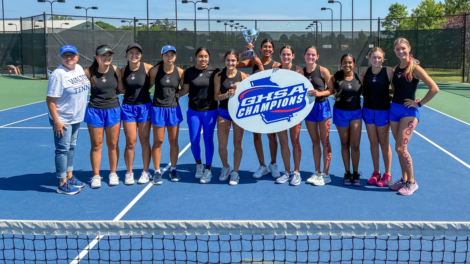 Walton girls tennis hoists the trophy