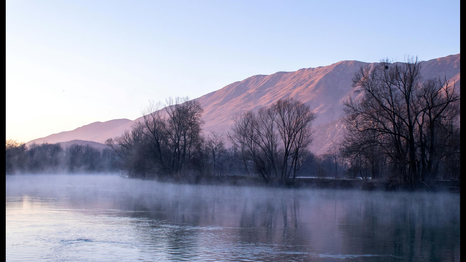 river with mountain in the background